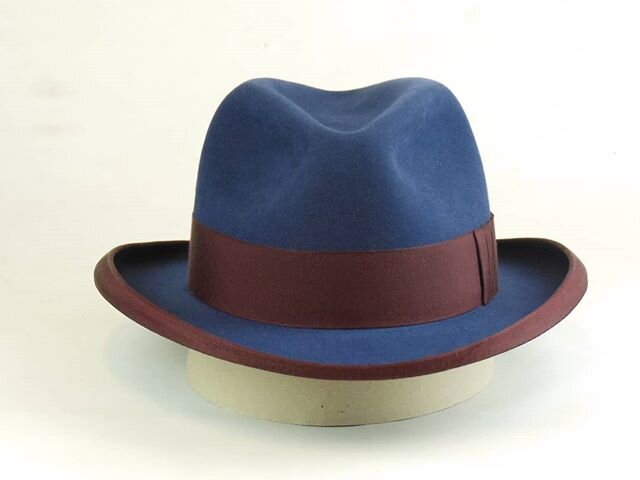 I like this one. Marine blue rabbit felt homburg. 5 1/2&quot; open crown with center crease and med. pinches. 1 3/4&quot; burgundy ribbon with shark gill bow. 3&quot; brim with homburg curl and burgundy french binding.
.
.
.
.
.
#northwesthats #theno