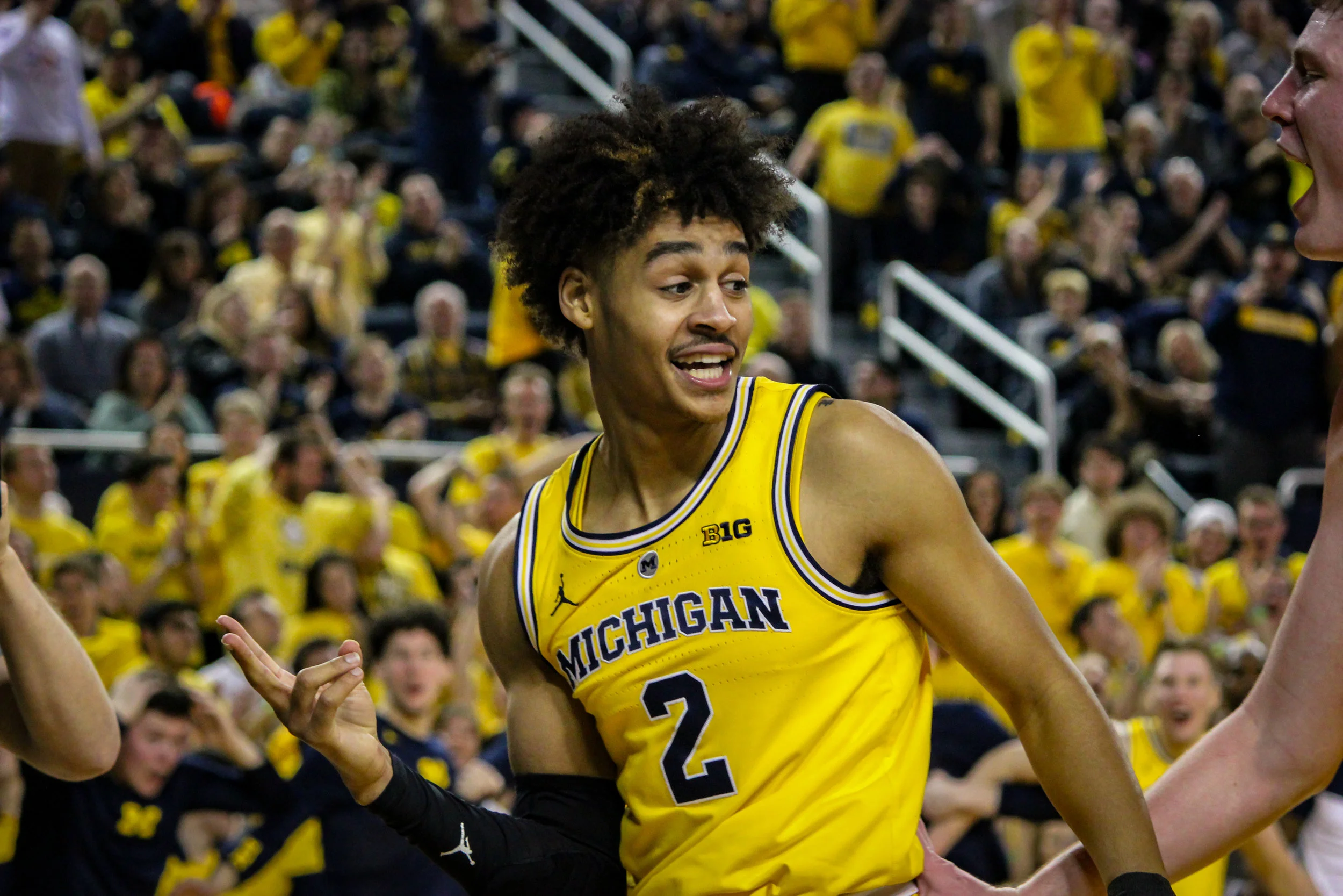 Jordan Poole posing after a score and a foul.