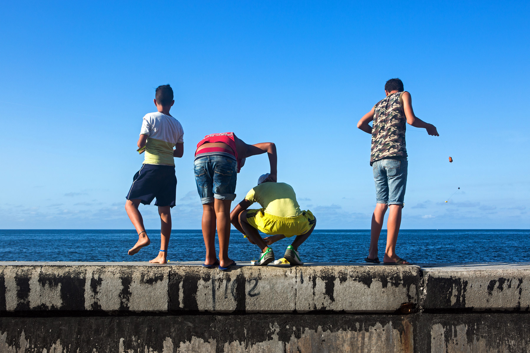 Kids fishing off the Malecon in Havana, Cuba