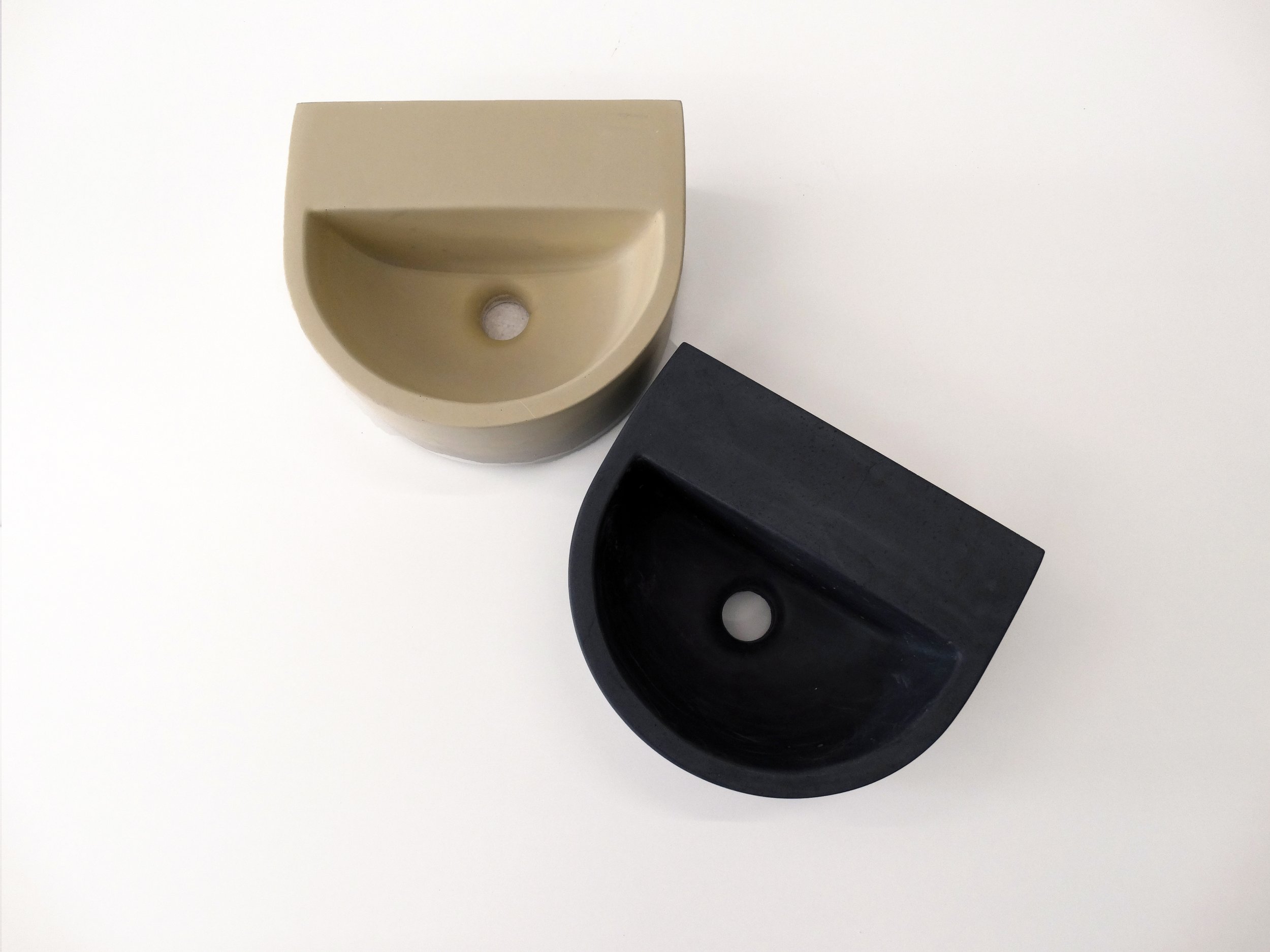 ONIK is a small semi round concrete basin, suitable for surface or wall mounting. Practical solution for smaller spaces and a classic design that will tie well with a number of bathroom styles.