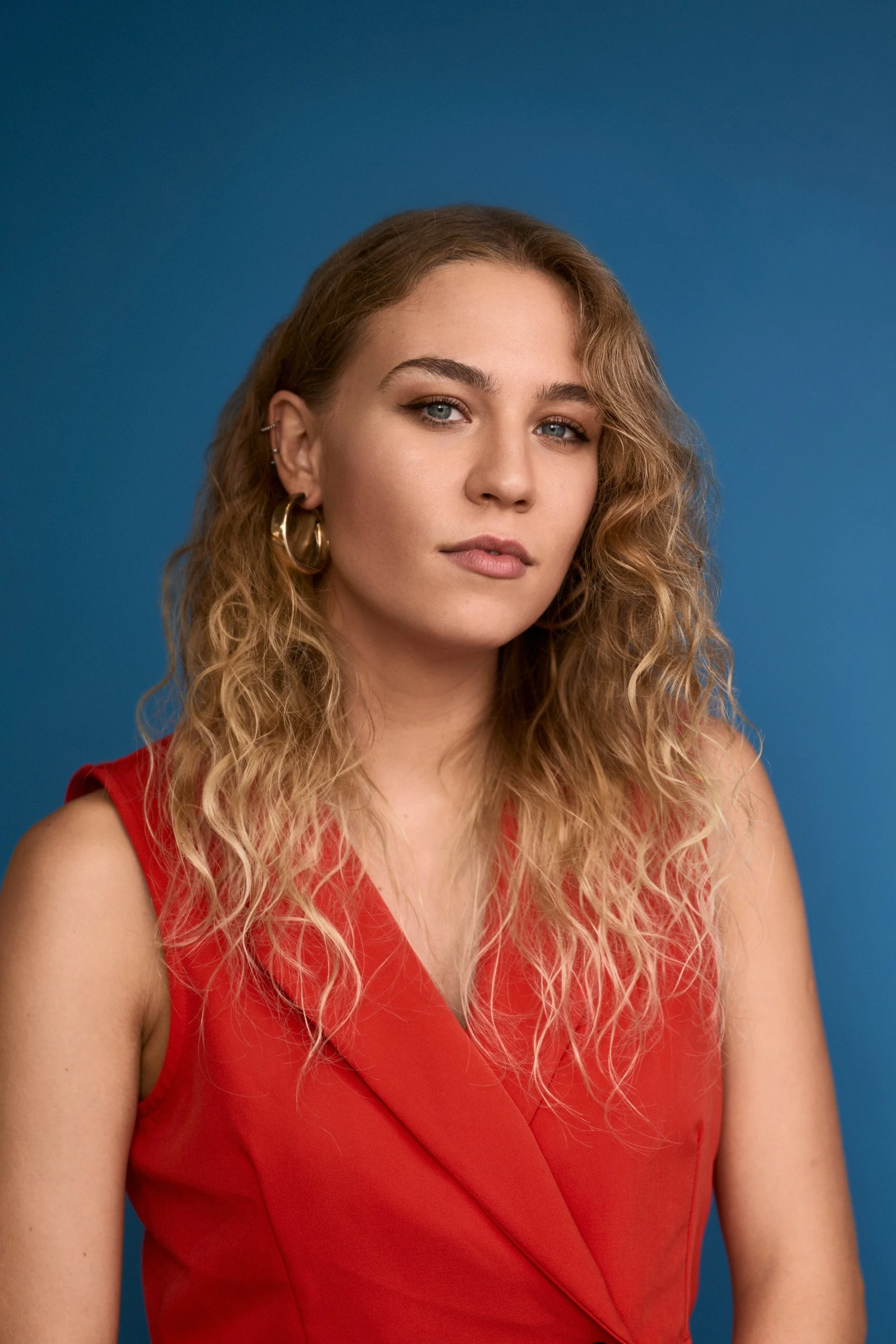 red-top-studio-headshot-on-blue-malta.jpg