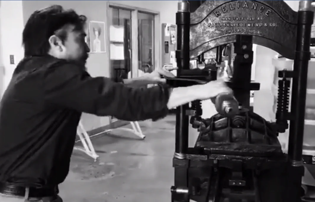 Pulling a print on the 1895 Reliance hand iron press, serial No. 25. Though a small Reliance, with only a 12 x 15 inch chase, this press is the perfect size to print posters, cards and broadsides.