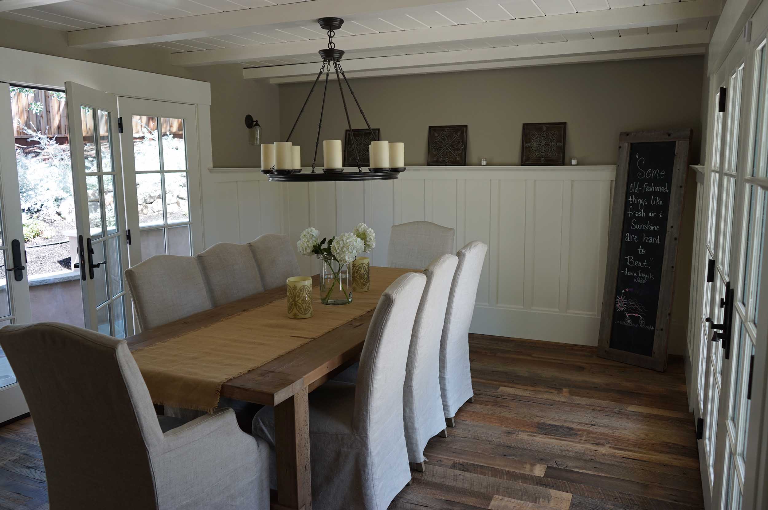 New wall paneling. Original beams have been painted. New doors and windows throughout house.