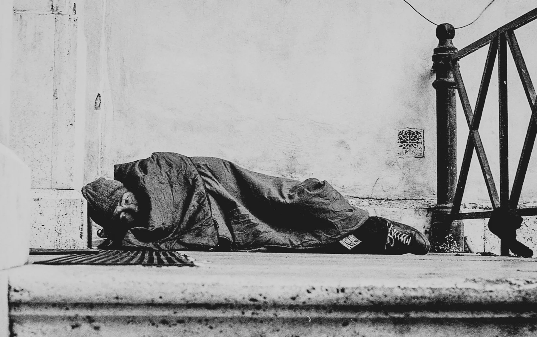 ABOVE and BELOW: My first encounter with a homeless man, sleeping on the steps of a church a ten minute walk from the city centre.