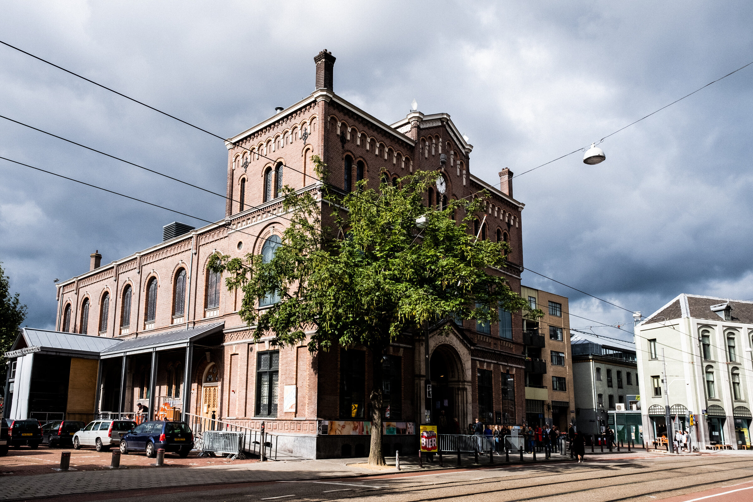  Paradiso, located near Leidseplein in the vibrant heart of Amsterdam, as seen from the side, Amsterdam, September 6, 2020. Visitors in cue come to see a Sunday morning show of Michelle David &amp; the Gospel Sessions.  