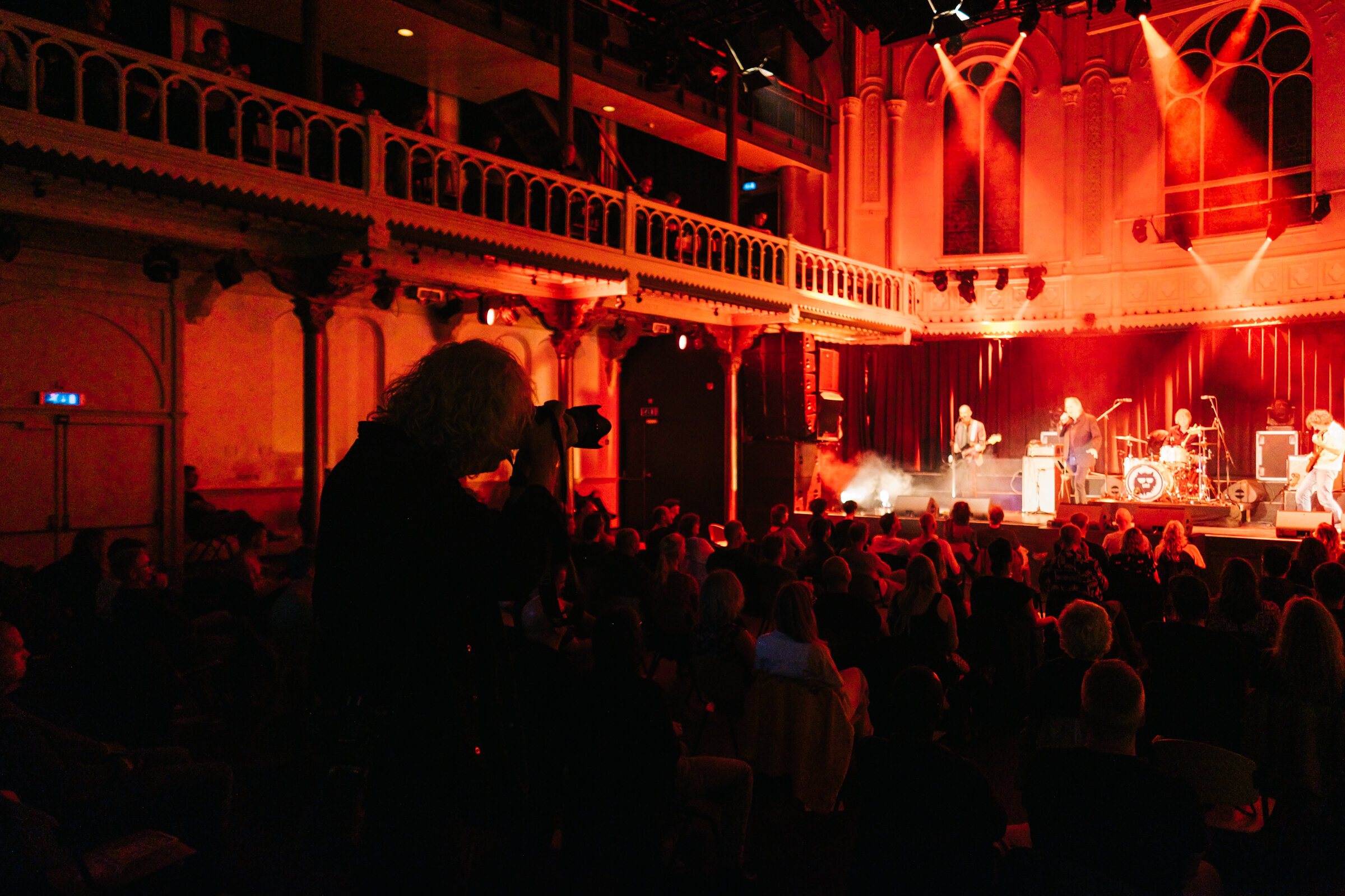  Photographer Willem Schalekamp photographs a Claw Boys Claw concert at Paradiso from a distance, Amsterdam, August 28, 2020. Photographers are not allowed to shoot front of stage anymore, as this would put them between a seated audience and they can