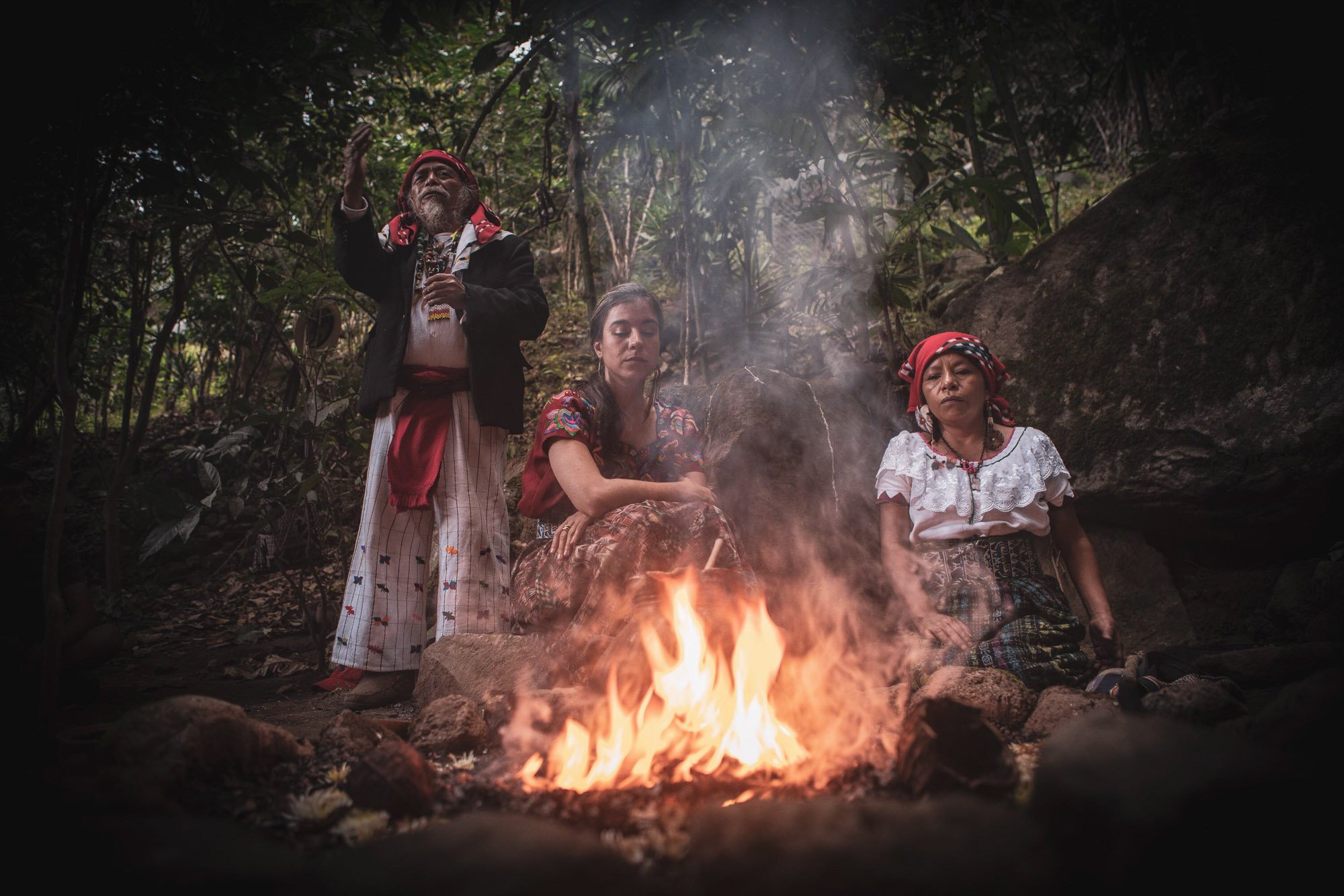 Man and women around a sacred fire