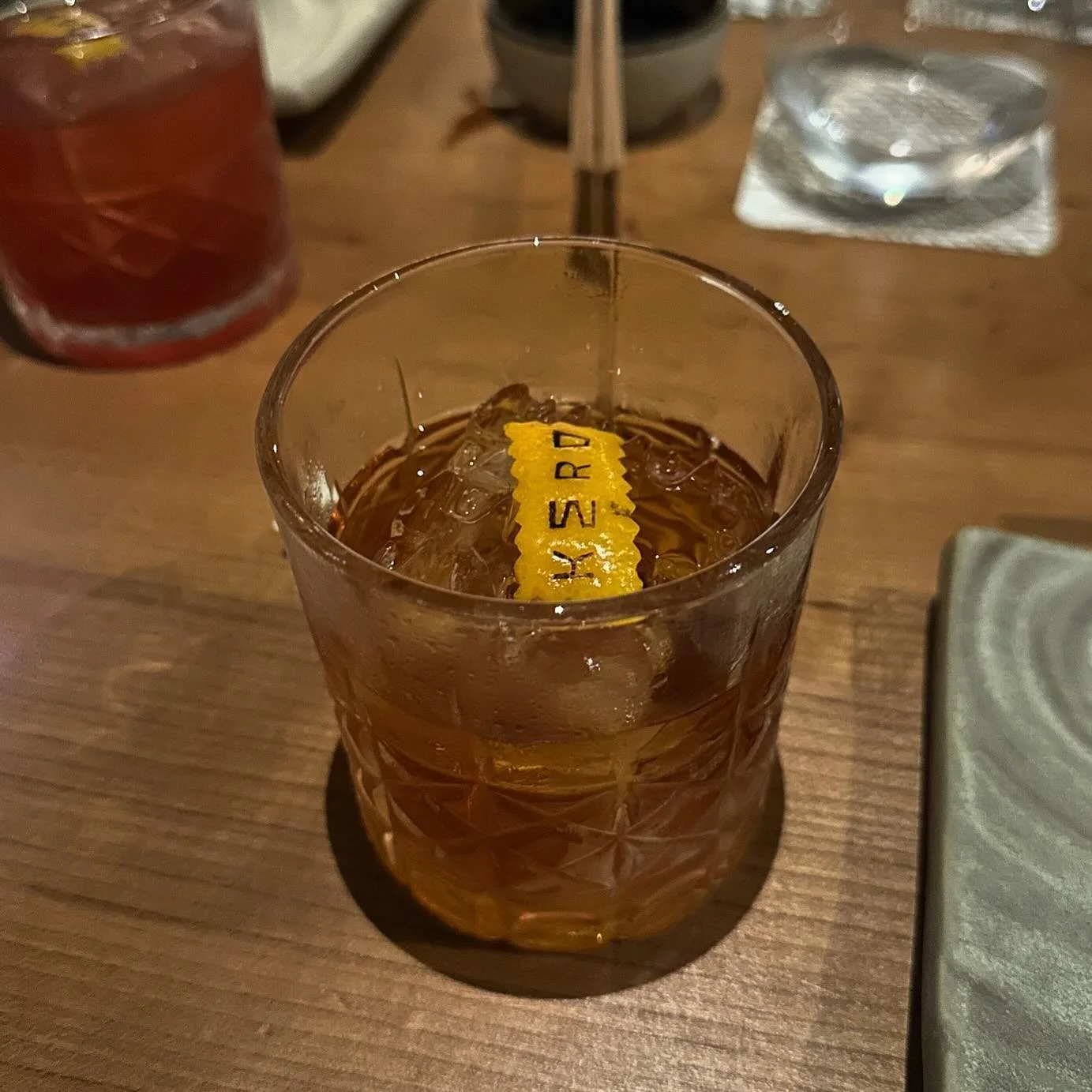 the Osaka OF took me by SURPRISE. it was clean, smooth, and had just the right amount of sweetness to it. the glass was pretty, the ice cube was a big rock, and it had a decorative orange peel dropped on top. i&rsquo;m honestly not sure what it says 