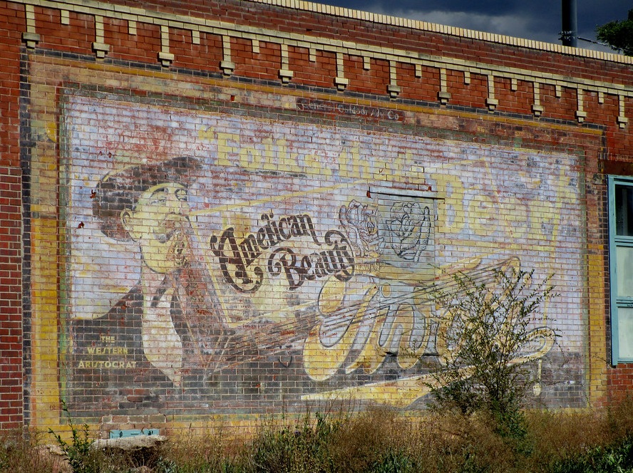  An early logo on an old painted billboard in Denver 