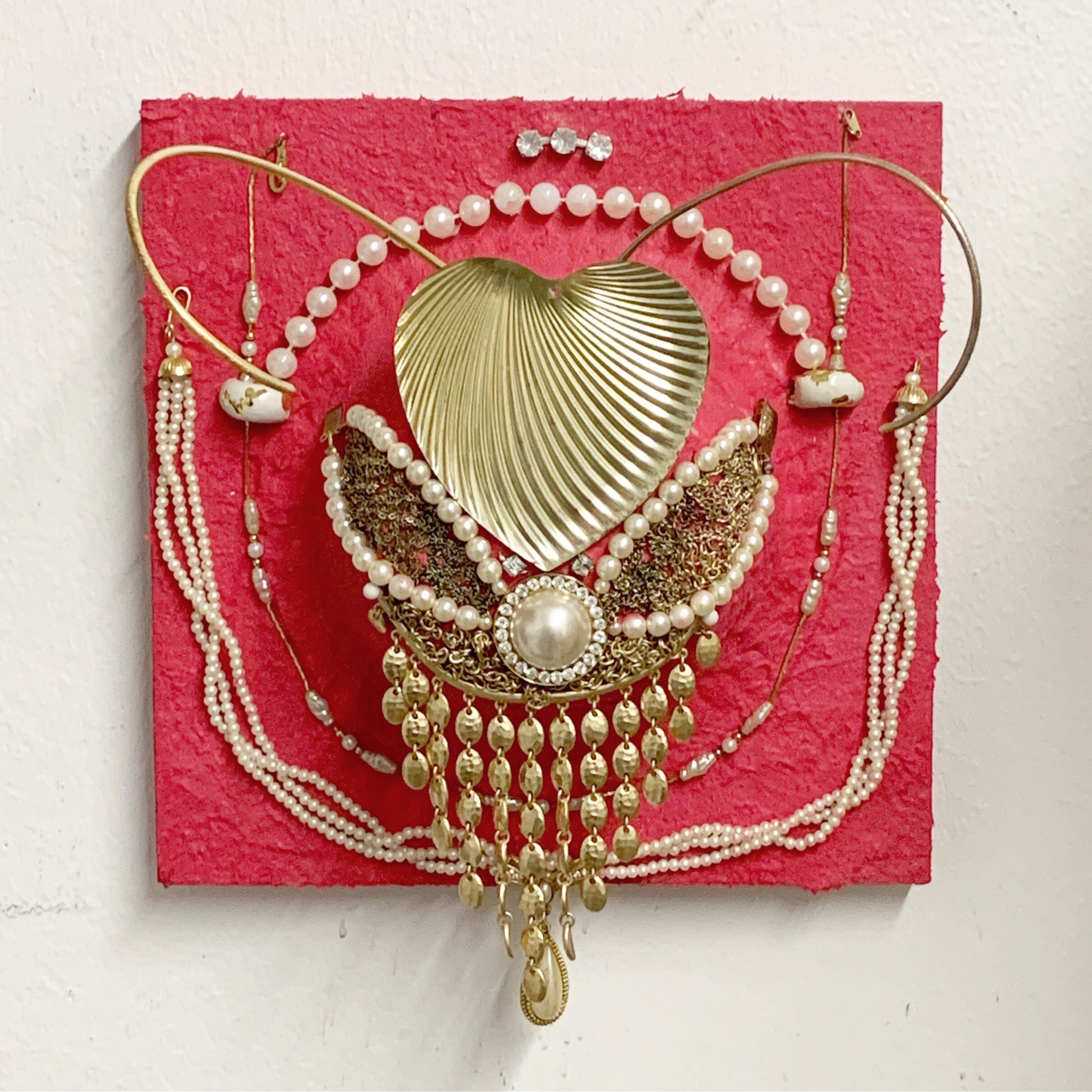   Cupid’s Chokehold,  2020, costume jewelry, faux pearls, rhinestones, and fiber paste on panel, 8x8” 