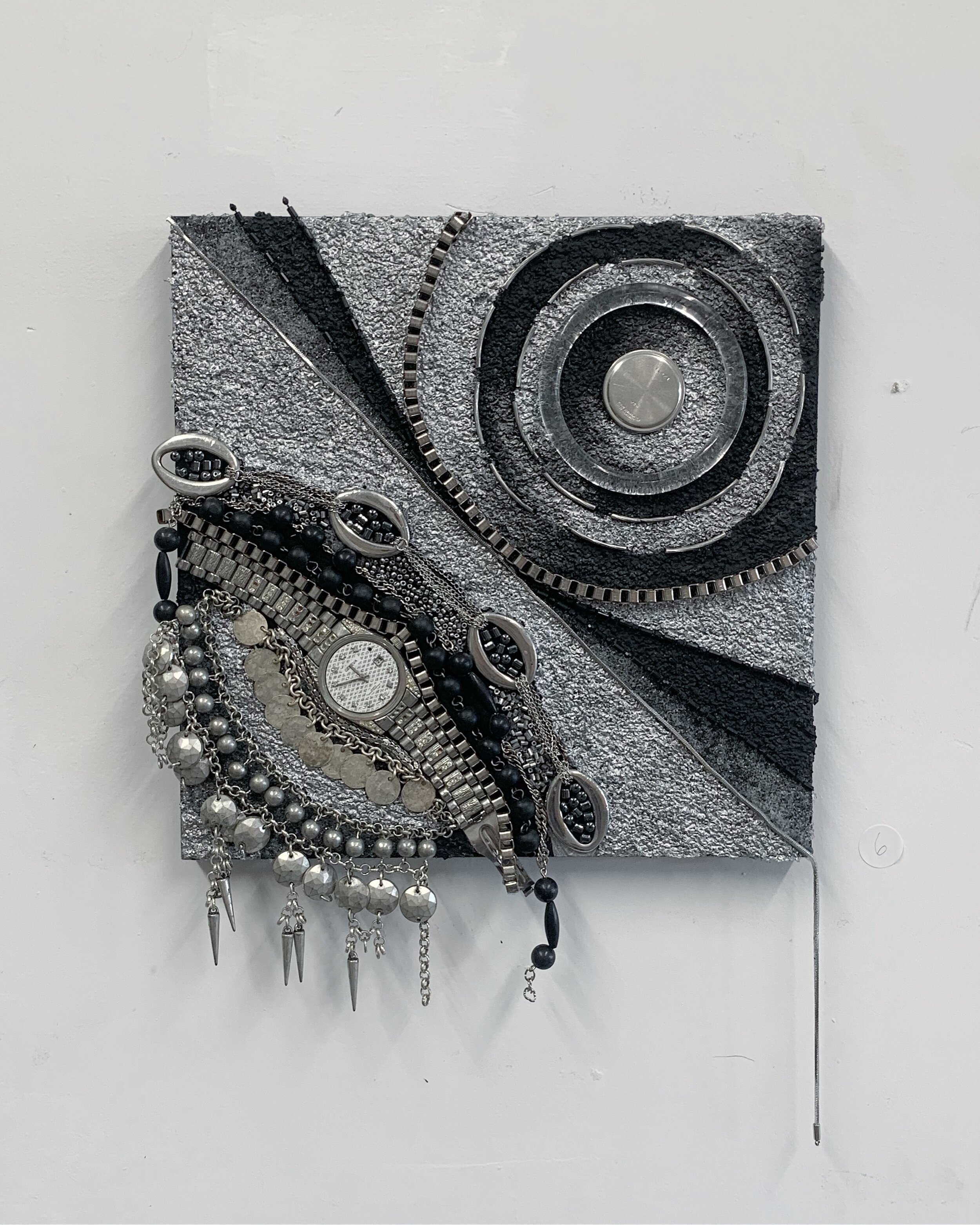   Geneva Watch,  2019 Wrist watch, costume jewelry, necklaces, beads and gel bead medium on panel, 10x10“ 