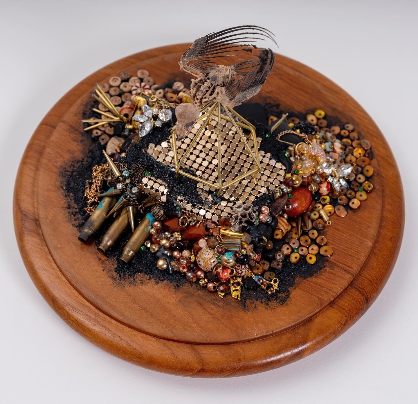 A top view of this piece without the glass covering #costumejewelry #assemblageart #foundobjects #beads #bird #skeleton #rhinestones #art912