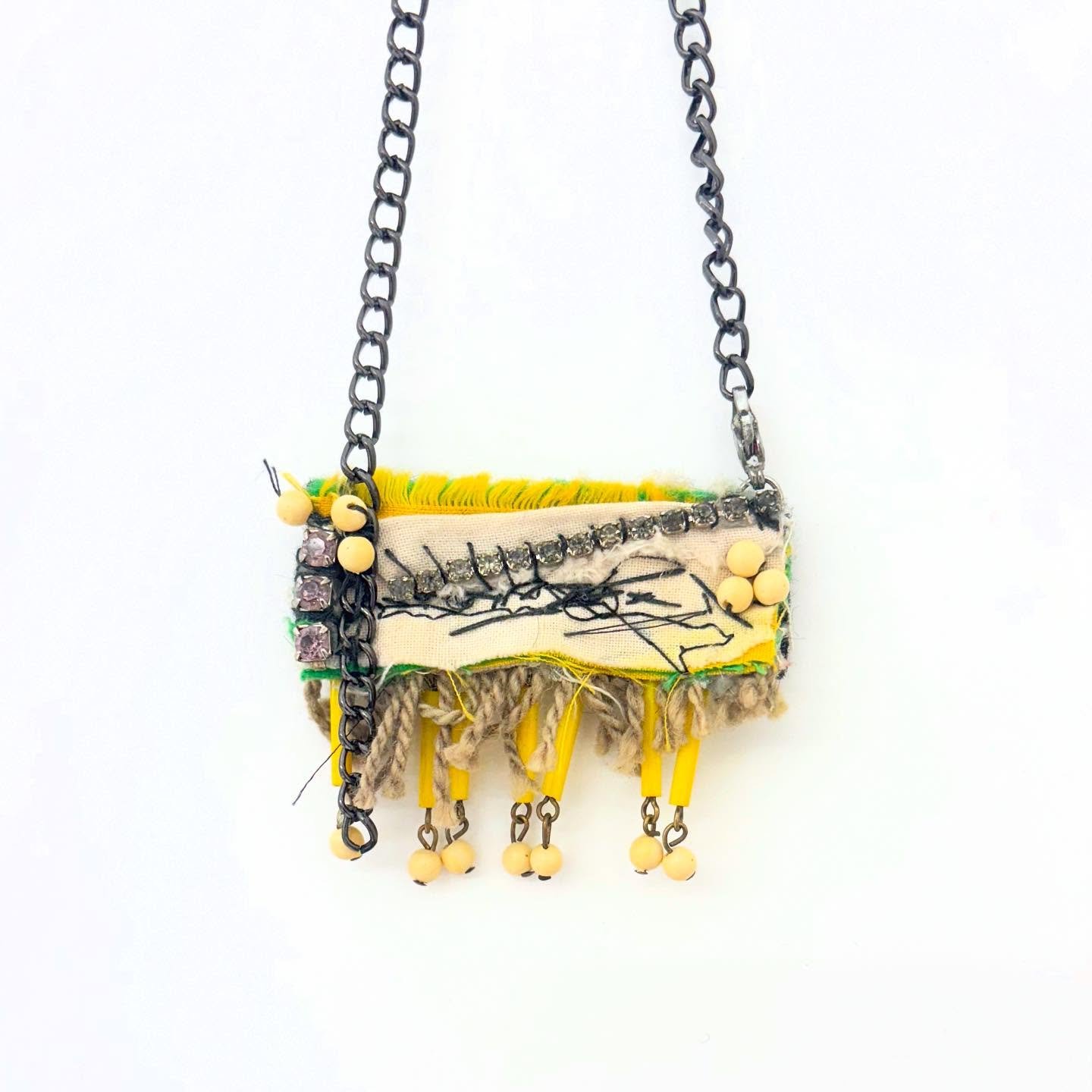 Hand-sewn with fibers, rhinestones, and found jewelry, this necklace transforms forgotten pieces into a bold statement ✨✨ #JewelryAssemblage #WearableArt #HandmadeJewelry&rdquo; #SustainableFashion