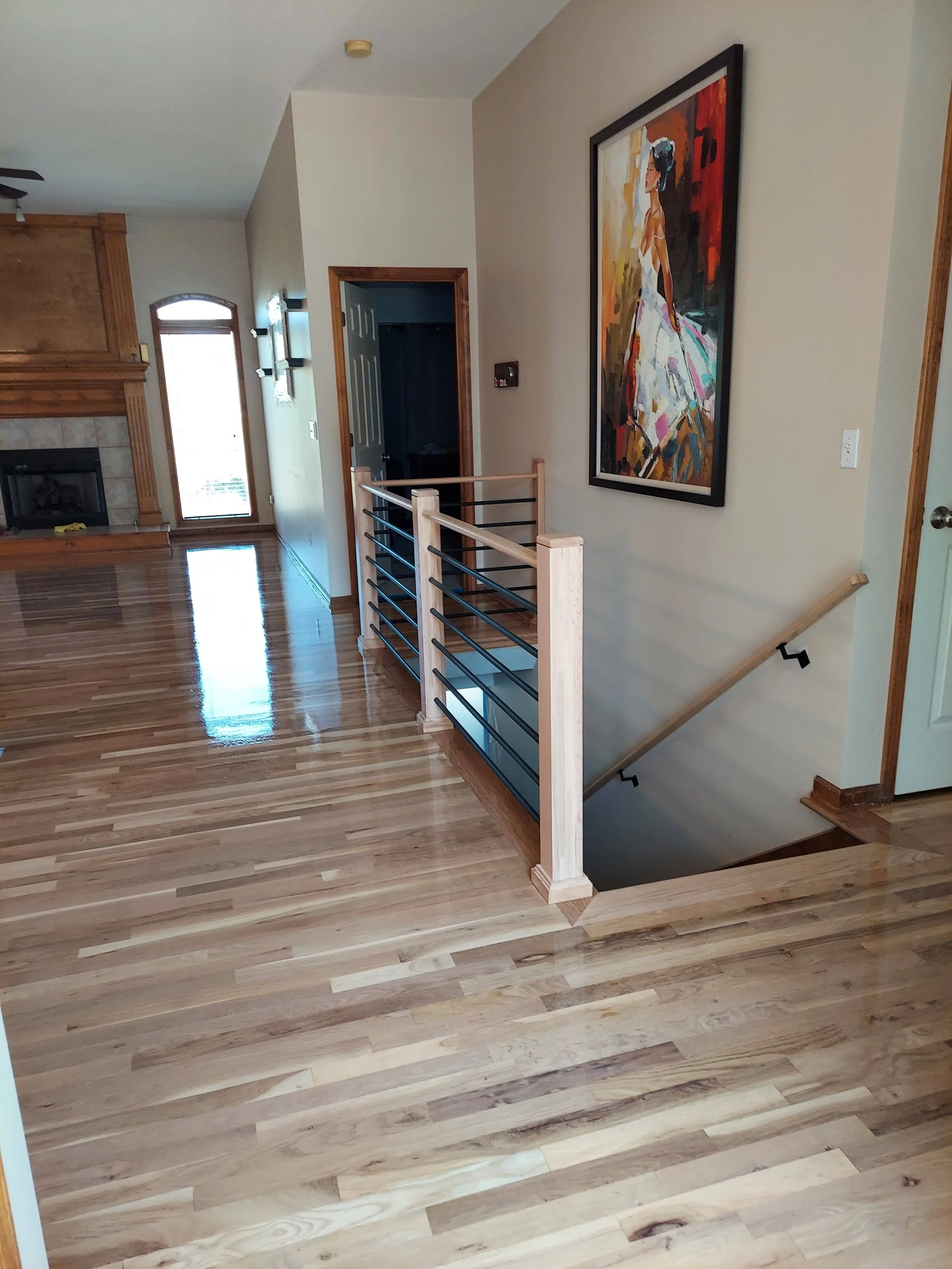 Hardwood flooring with custom horizontal railing