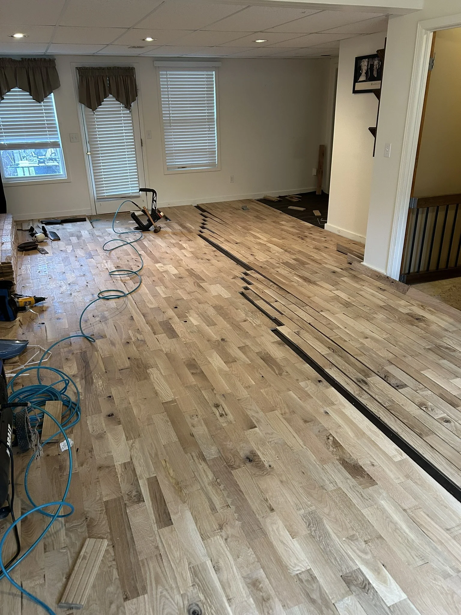 Rustic white oak hardwood floor installation in progress