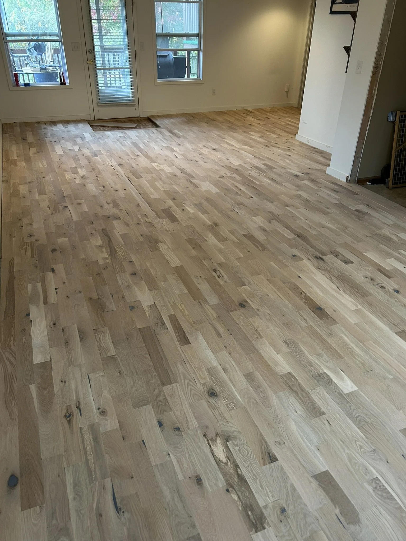 New rustic white oak hardwood flooring before finishing