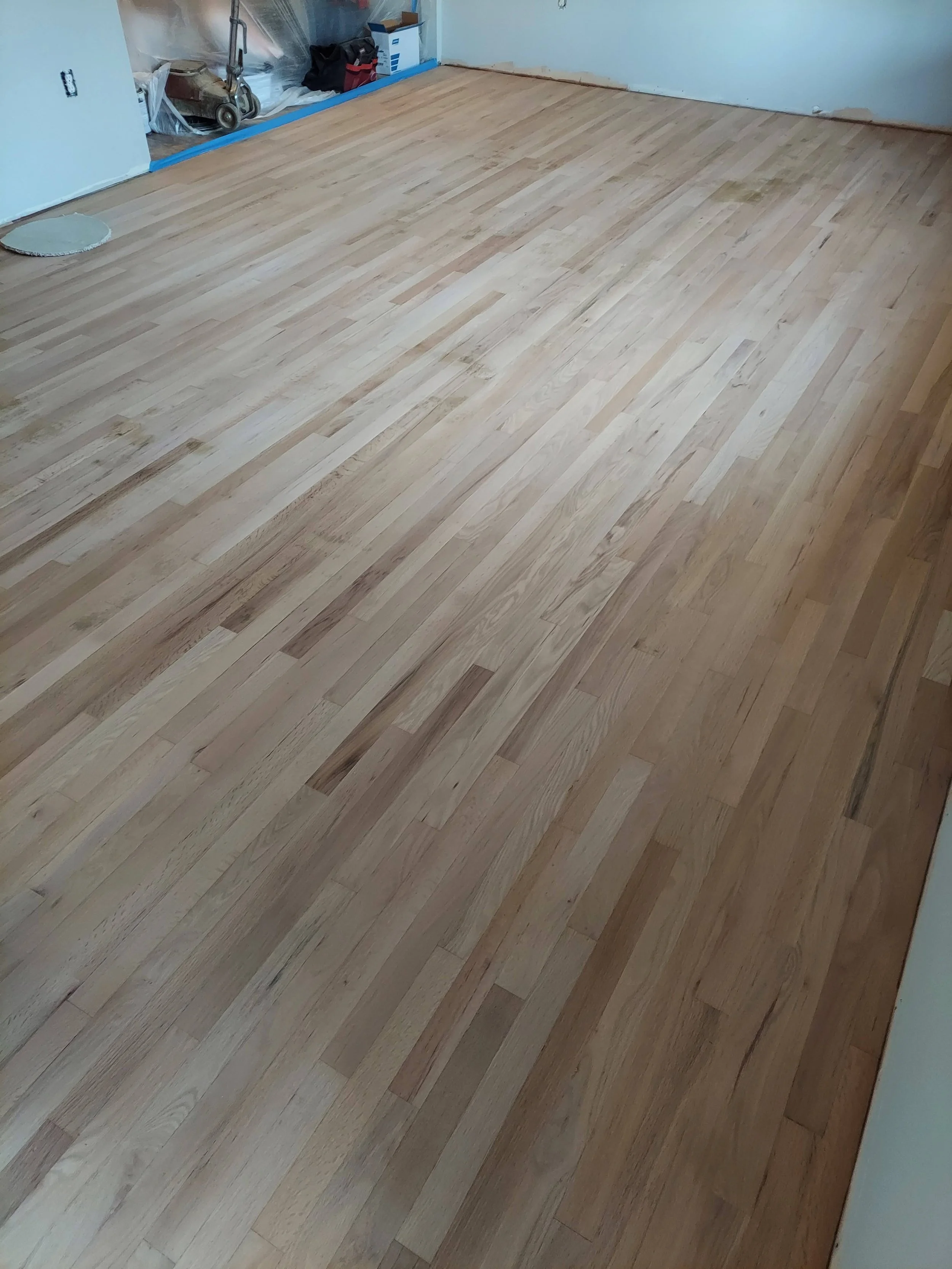 Living room hardwood floor after sanding