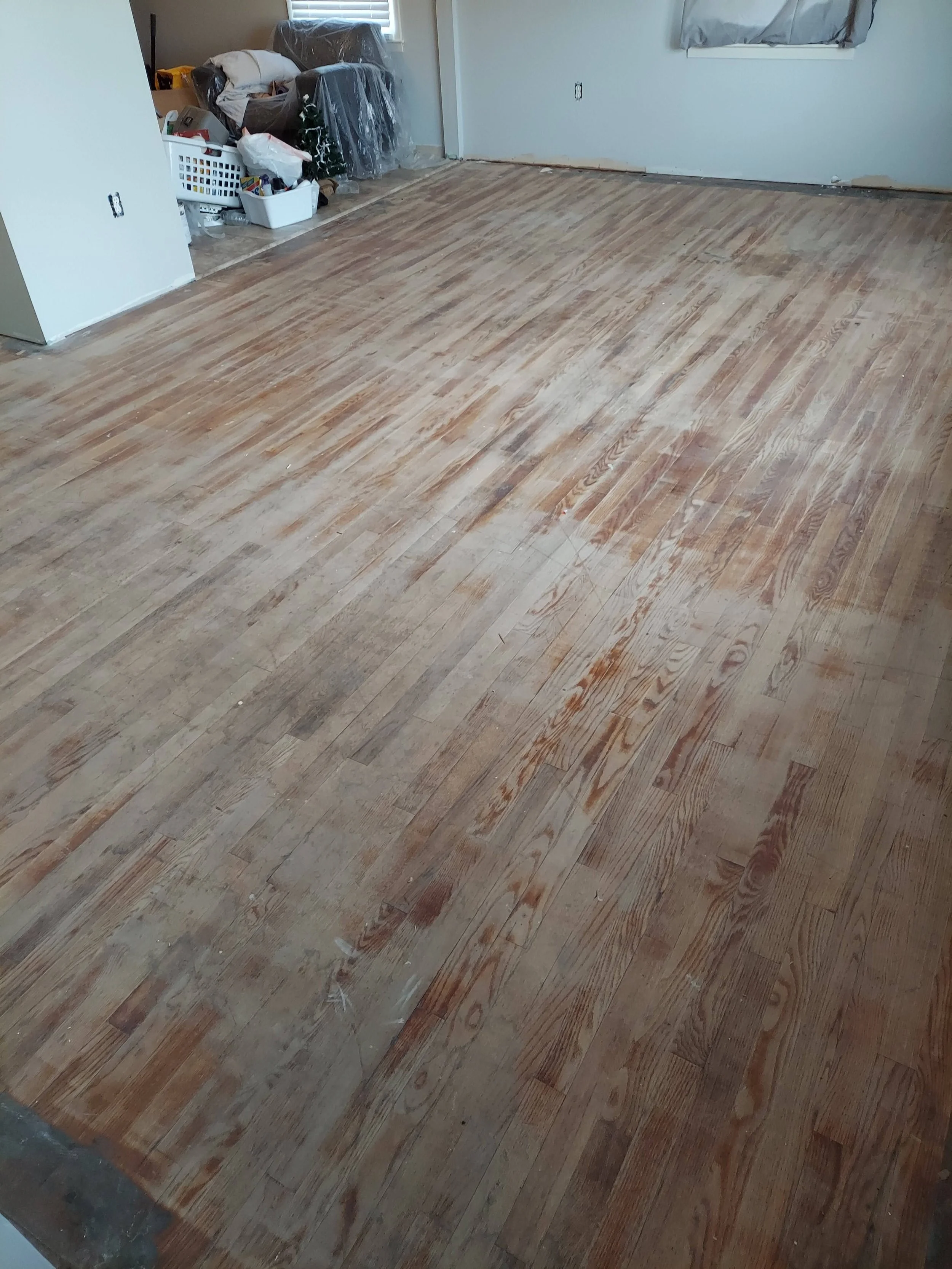 Living room hardwood floor during sanding
