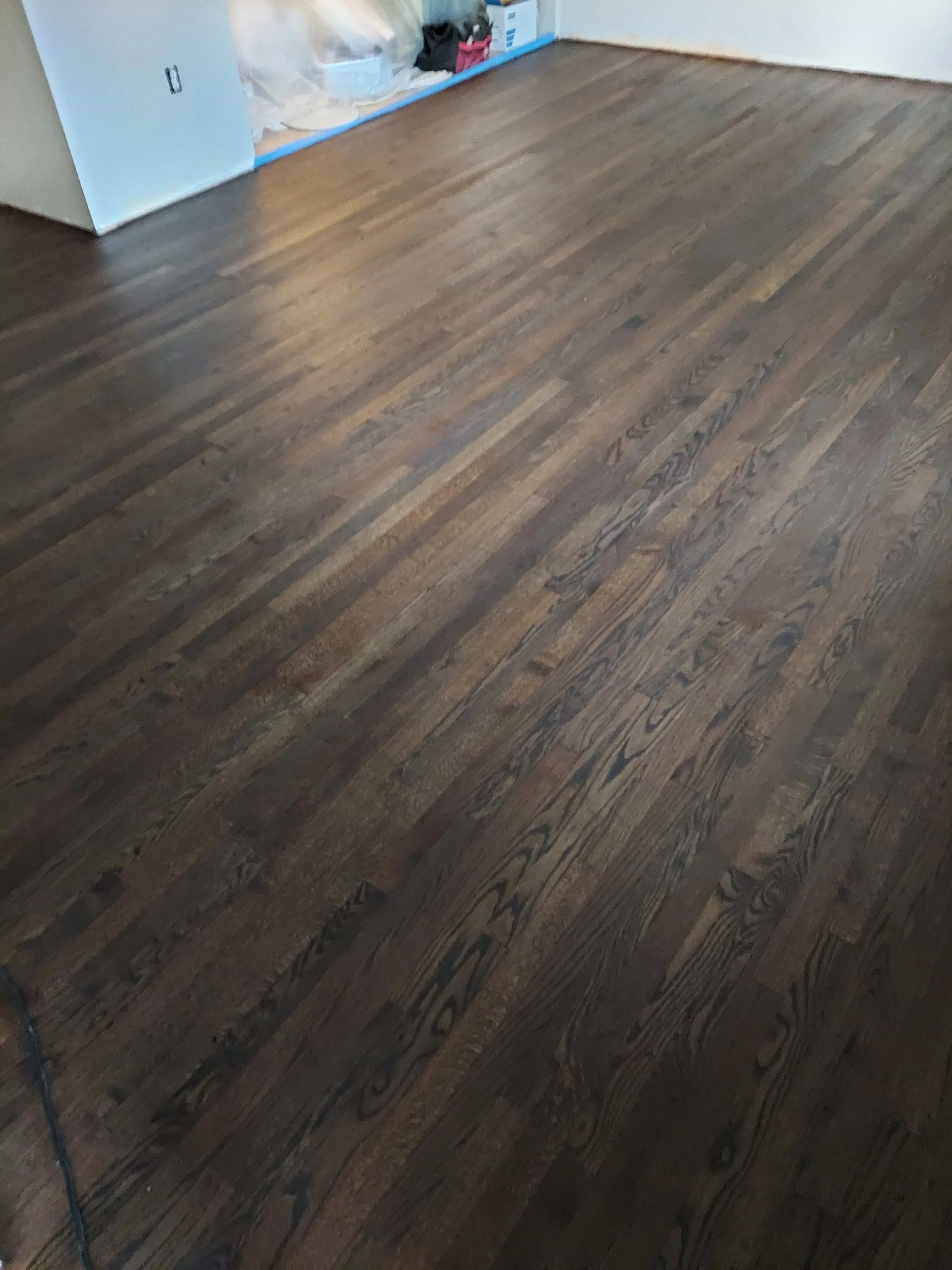 Living room hardwood floor after staining