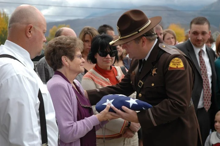 UHP Colonel handing my late grandmother the flag from my grandfather’s casket. He served in the U.S. Army during the Korean conflict, after which se served as a Utah Highway Patrol for 35 years. Following that career, he served as Head of Security a…