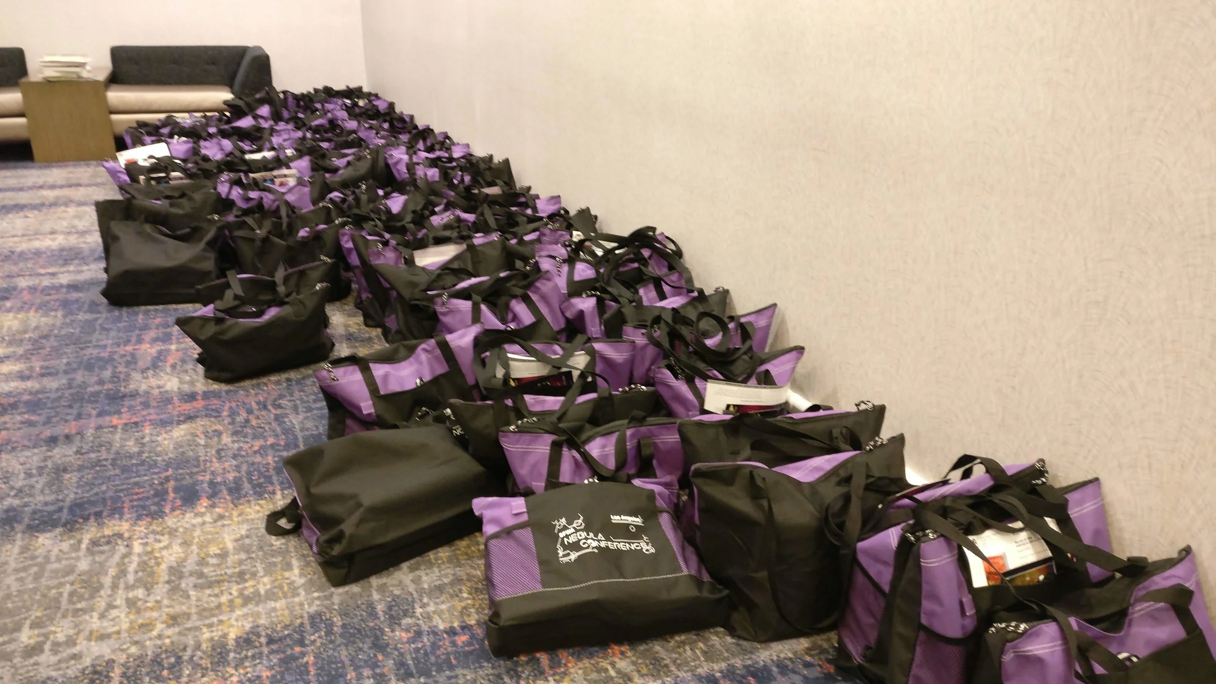 2019 Nebula Conference book bags, ready to be picked up.