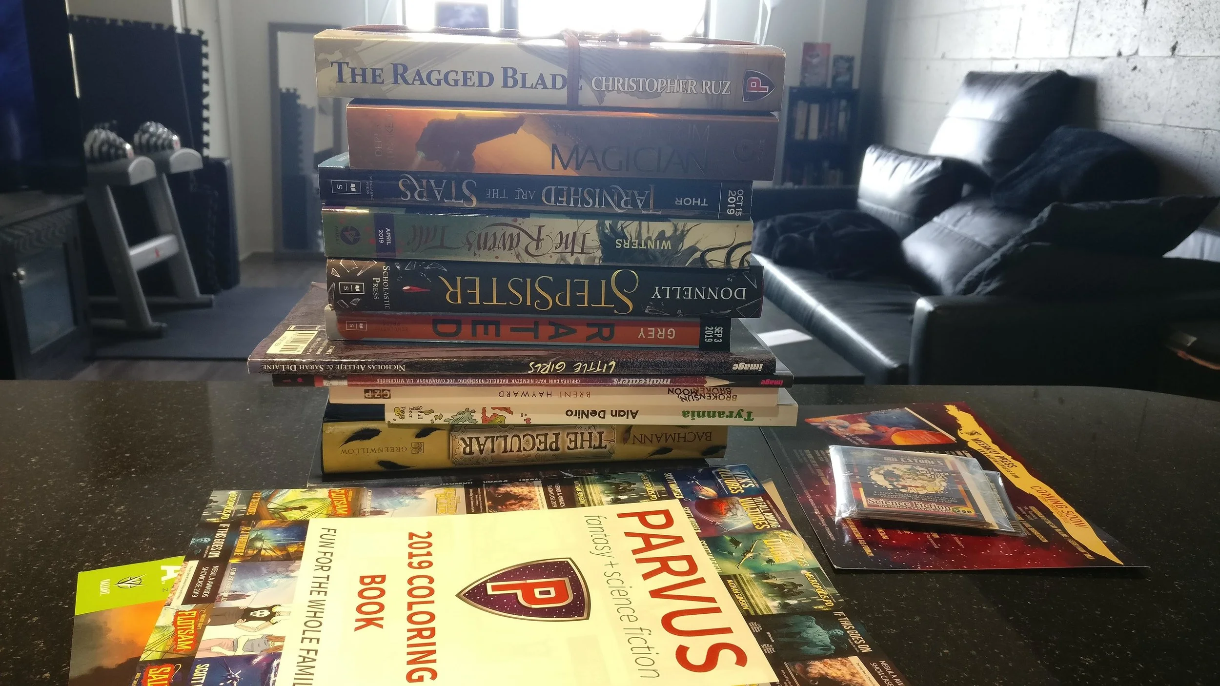 The FREE stack of books I returned from the 2019 Nebulas with.