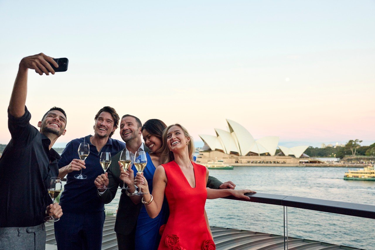 People smiling for a selfie.