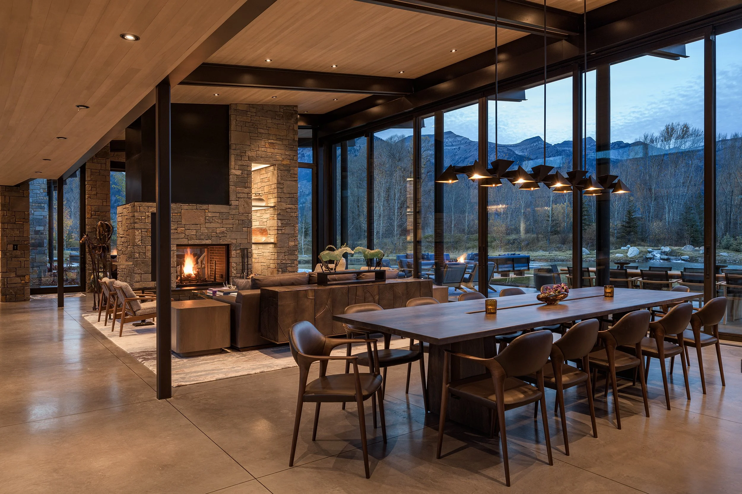 Ward_Blake_Architects_ChaChe_Residence_Interior_Dining_Living_Room_Dusk_Fireplace_Mountain_Views_Stone_Concrete_Detail.jpg