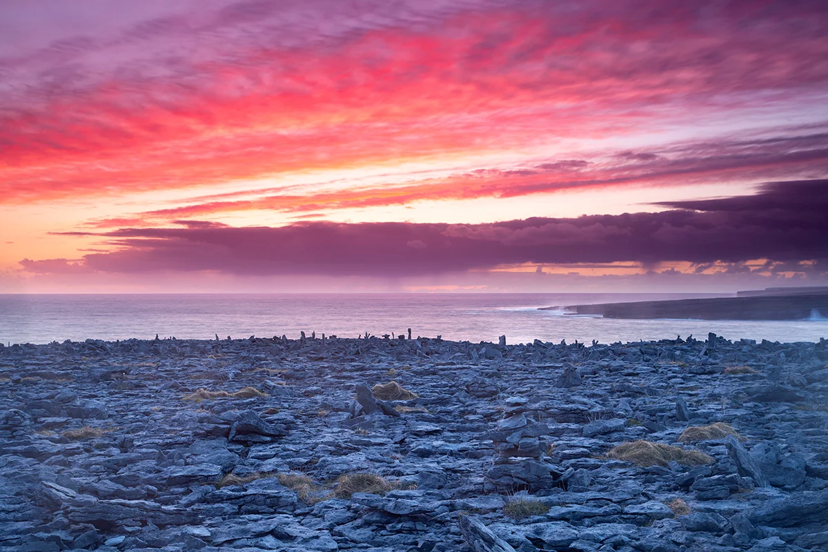 View of sunset over Inis Mór from Inis Meáin
