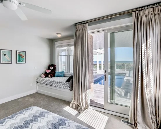 49612ed50c58a716_3553-w550-h440-b0-p0-q87--beach-style-bedroom.jpg
