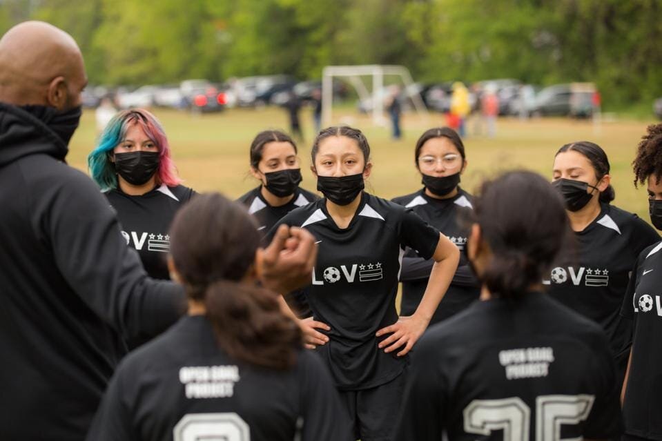 https___specials-images.forbesimg.com_imageserve_611ed1ce39fa6c652442b14b_A-group-of-female-soccer-players-get-together-during-a-coaching-session-at-Open-Goal-_960x0.jpg