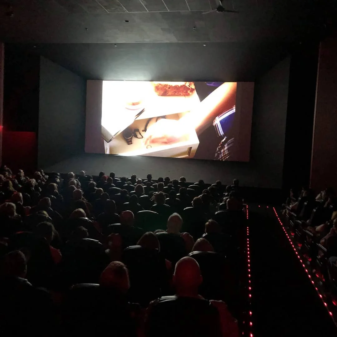 The capacity theater watching Murder Creek.
