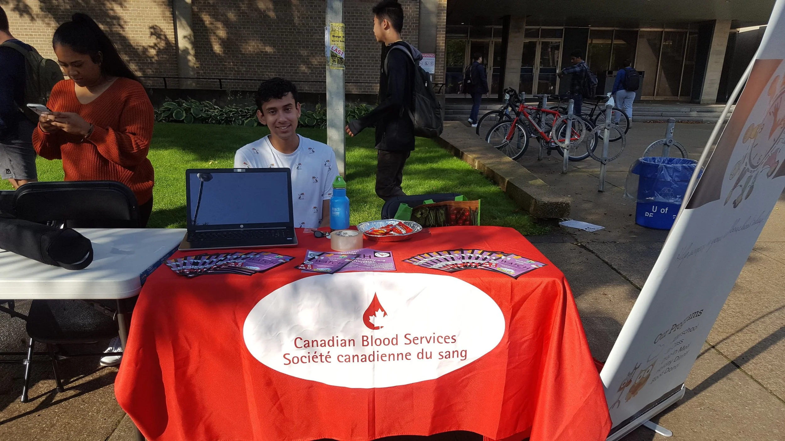 Brandon Jasztrab, our Holiday Dinner Co-Coordinator, at our Street Fest table. Photo by Sua Cho, After-School Programme Vice President.