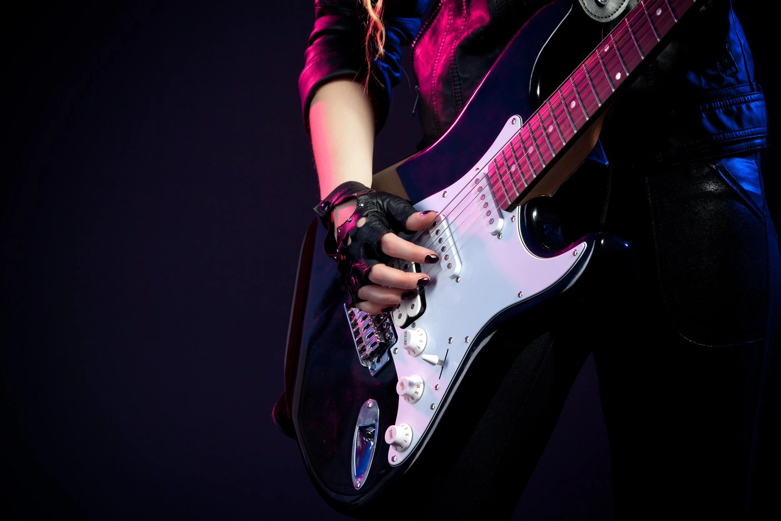 woman-in-black-leather-clothes-playing-guitar-2026-01-07-06-57-24-utc.jpg