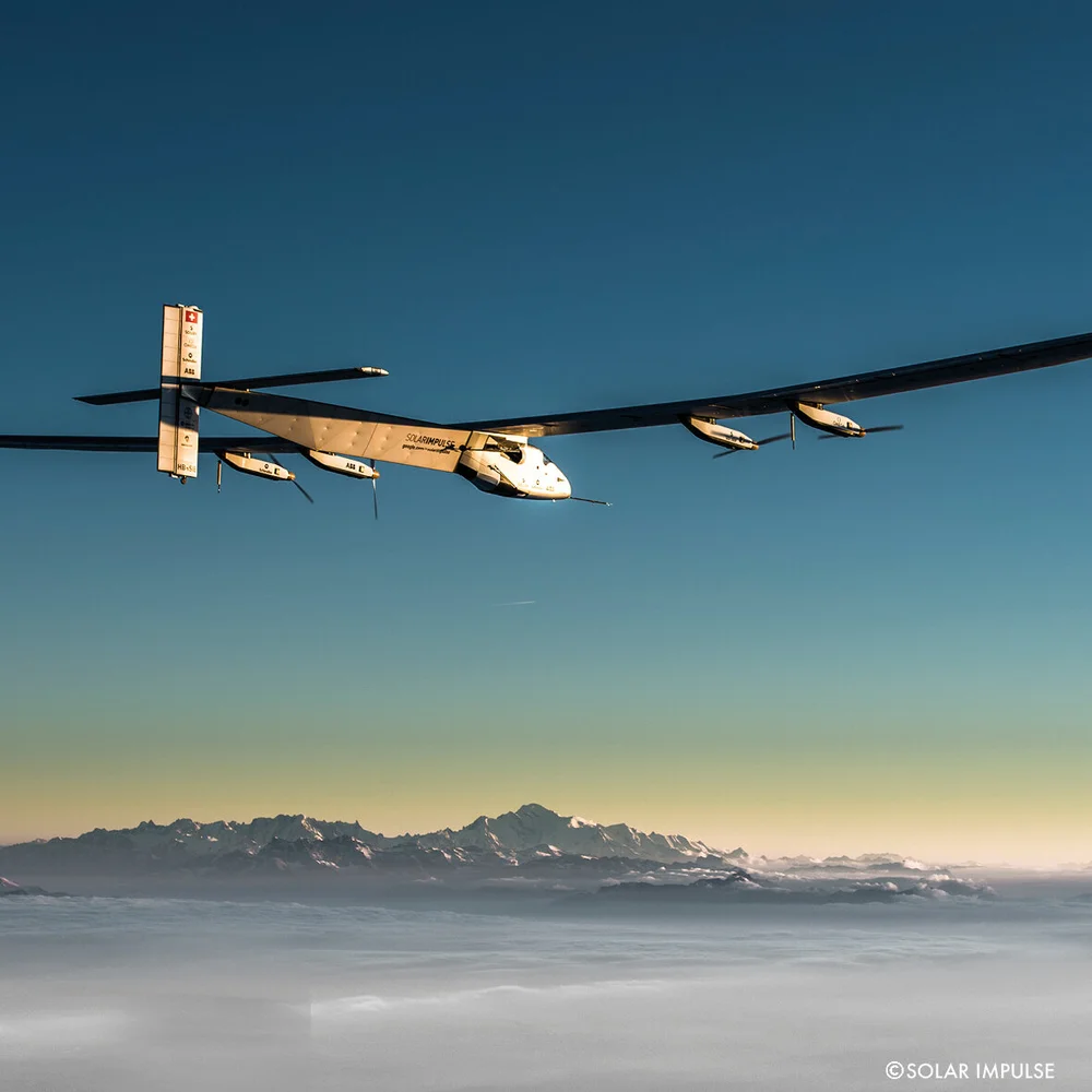 Bertrand Piccard speaking at an event, emphasizing the importance of teamwork in Solar Impulse