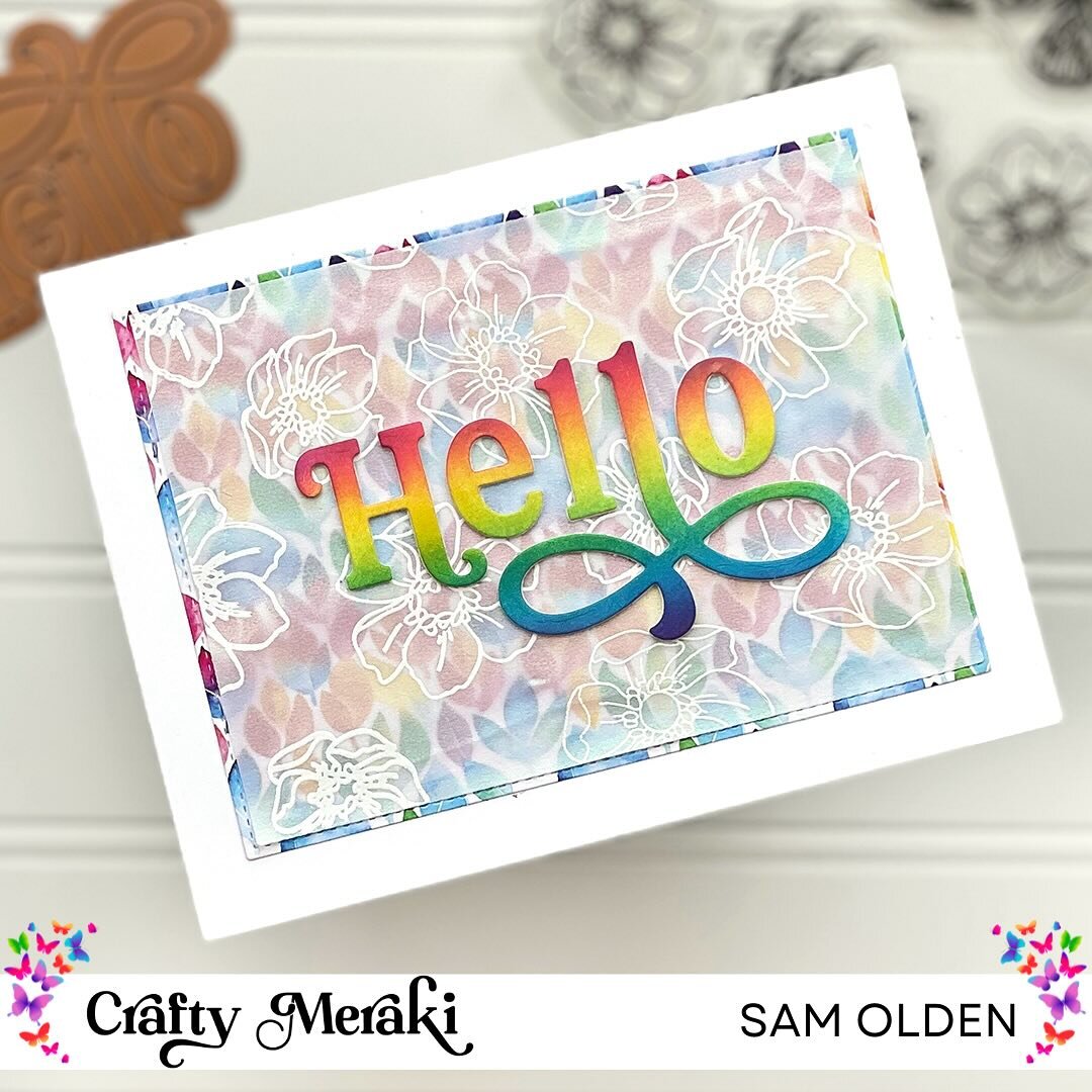 Sometimes vellum is perfect to tone down a bold background. @samjolden used shimmery vellum embossed with white flowers over the bright rainbow canopy paper to allow the hello die to pop. (Ad/Design Team post)

Products Used: 
Rainbow Canopy Paper 
H