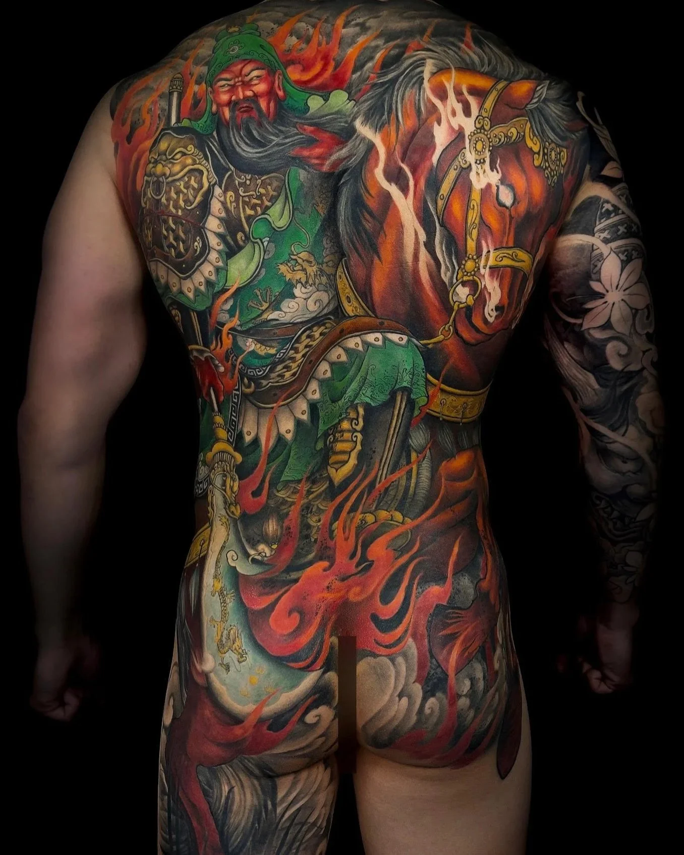 Jim Tran tattoo artist in Calgary specializing in custom Japanese tattoos at 9 Element Tattoos