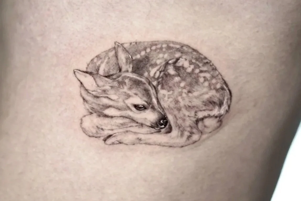 Liz Tay is a Calgary-based tattoo artist known for her mastery of micro-realism tattoo designs at 9 Element Tattoos.