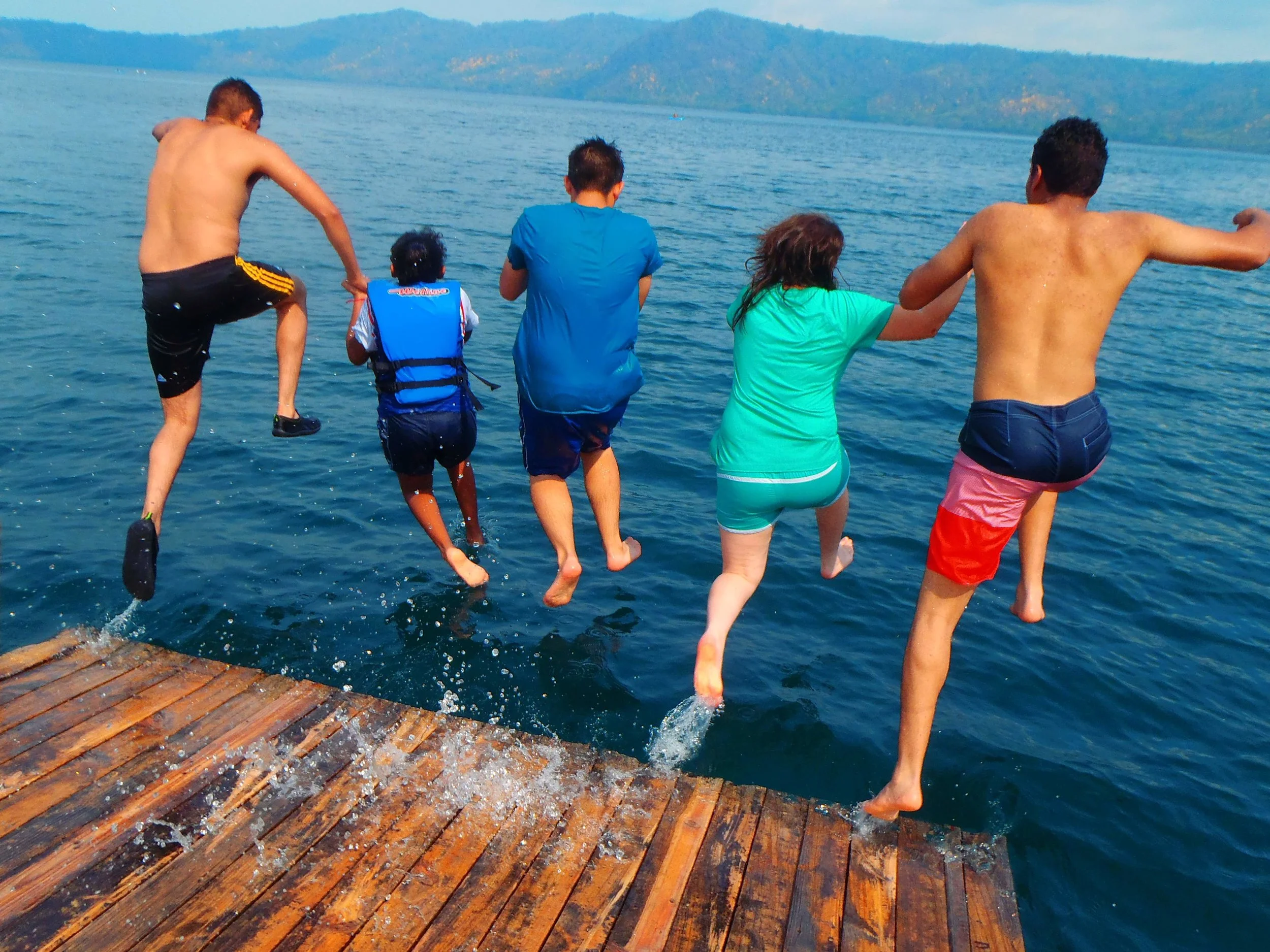 Laguna de Apoyo group jumping from dock.jpg