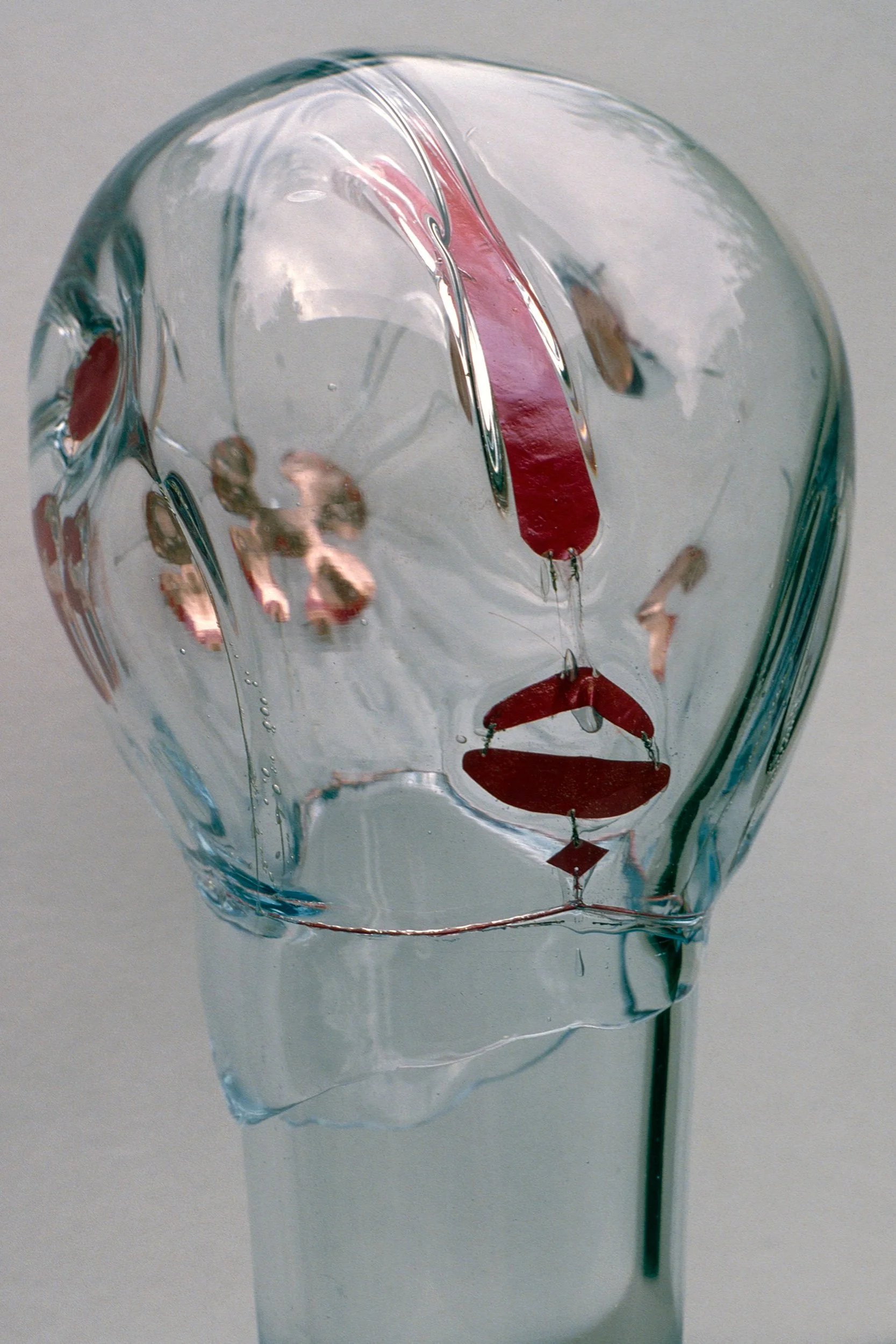 DAS0417-Don-Shepherd-artist-designer-glass-encased-metal-heads-sculpture-Transitional-Head-1981.jpg