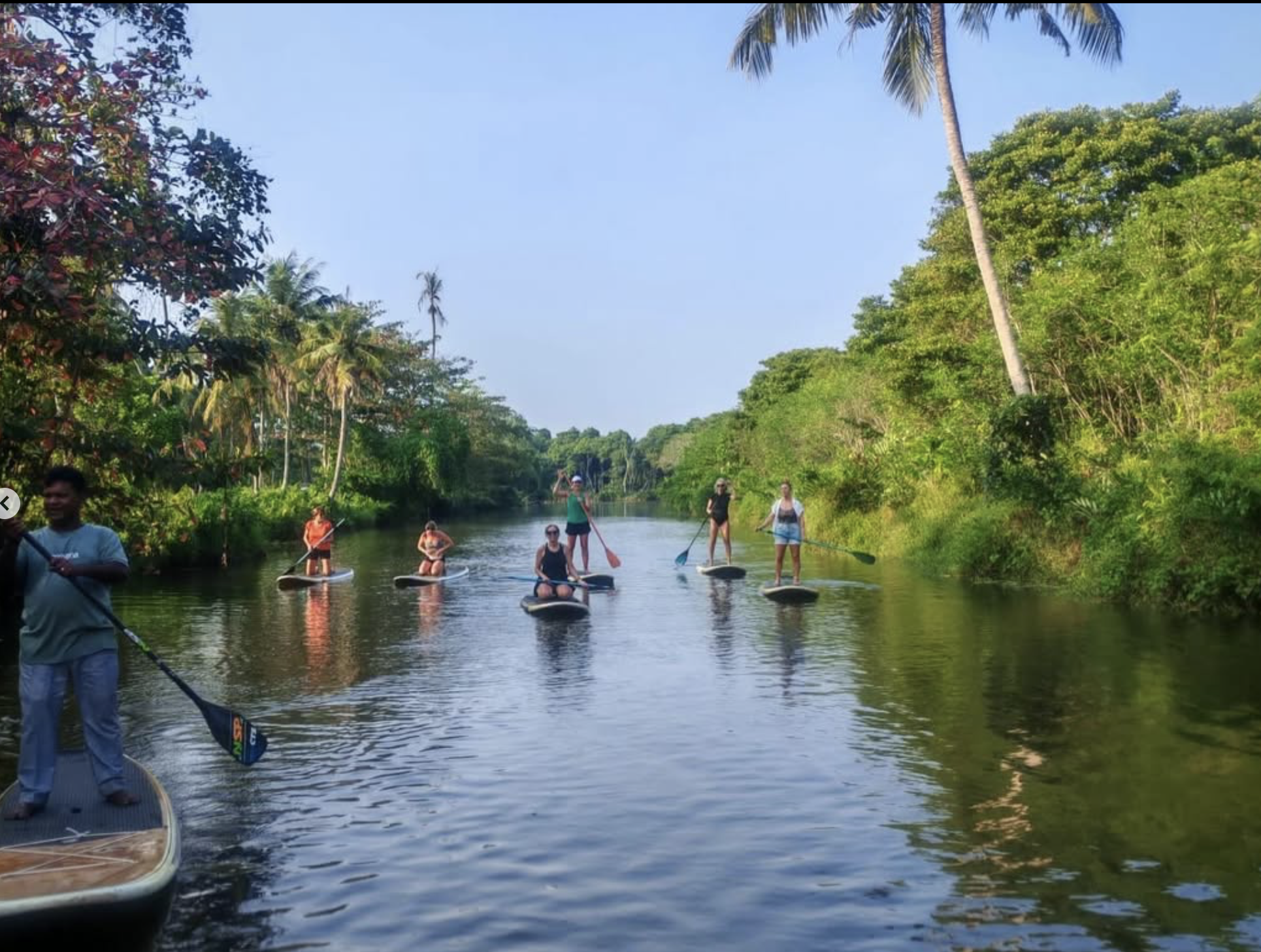 Guests enjoying the guided SUP safari included as part of the Sri Lanka retreat experience.