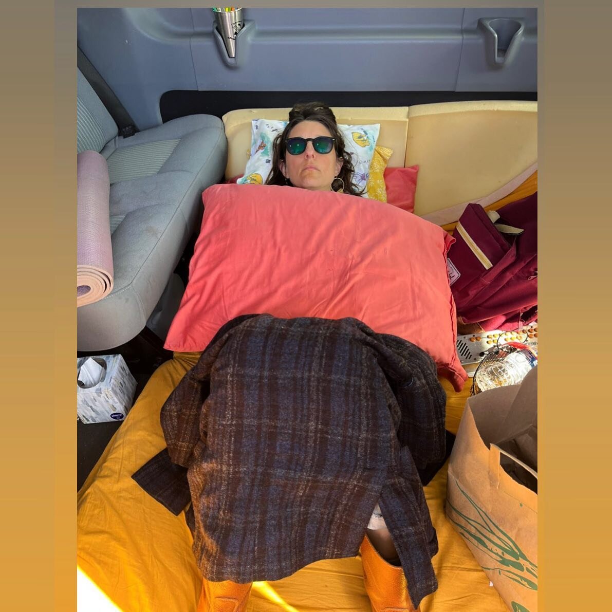 I love this picture so much. I feel like it encapsulates so much of my touring career&mdash; trying to bring some color into the gray van, catching a bit of rest before or after sound check, figuring out ways to bring coziness to a not-inherently-coz