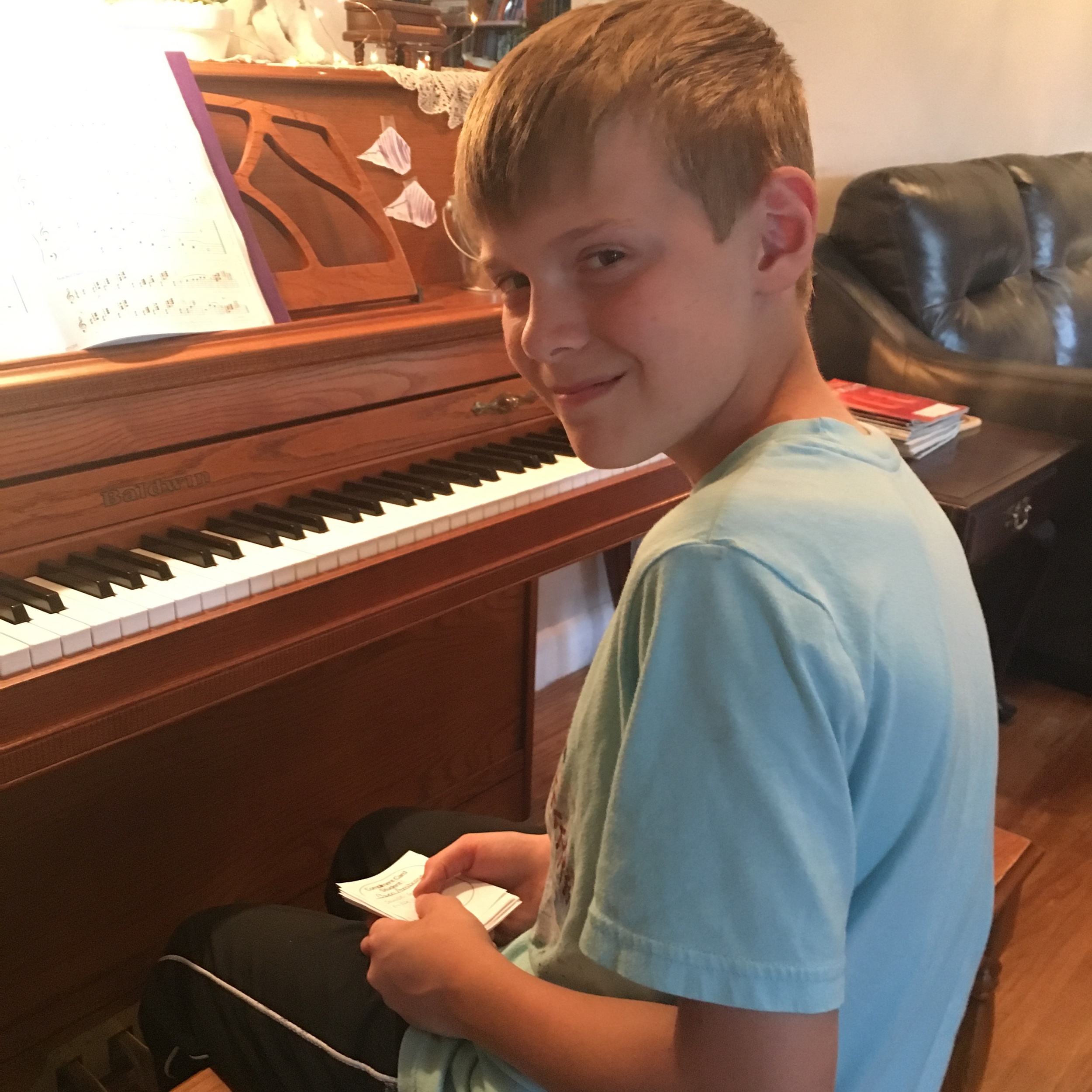  Mr. O beaming at all the lovely compliment cards he received after his recital performance. 