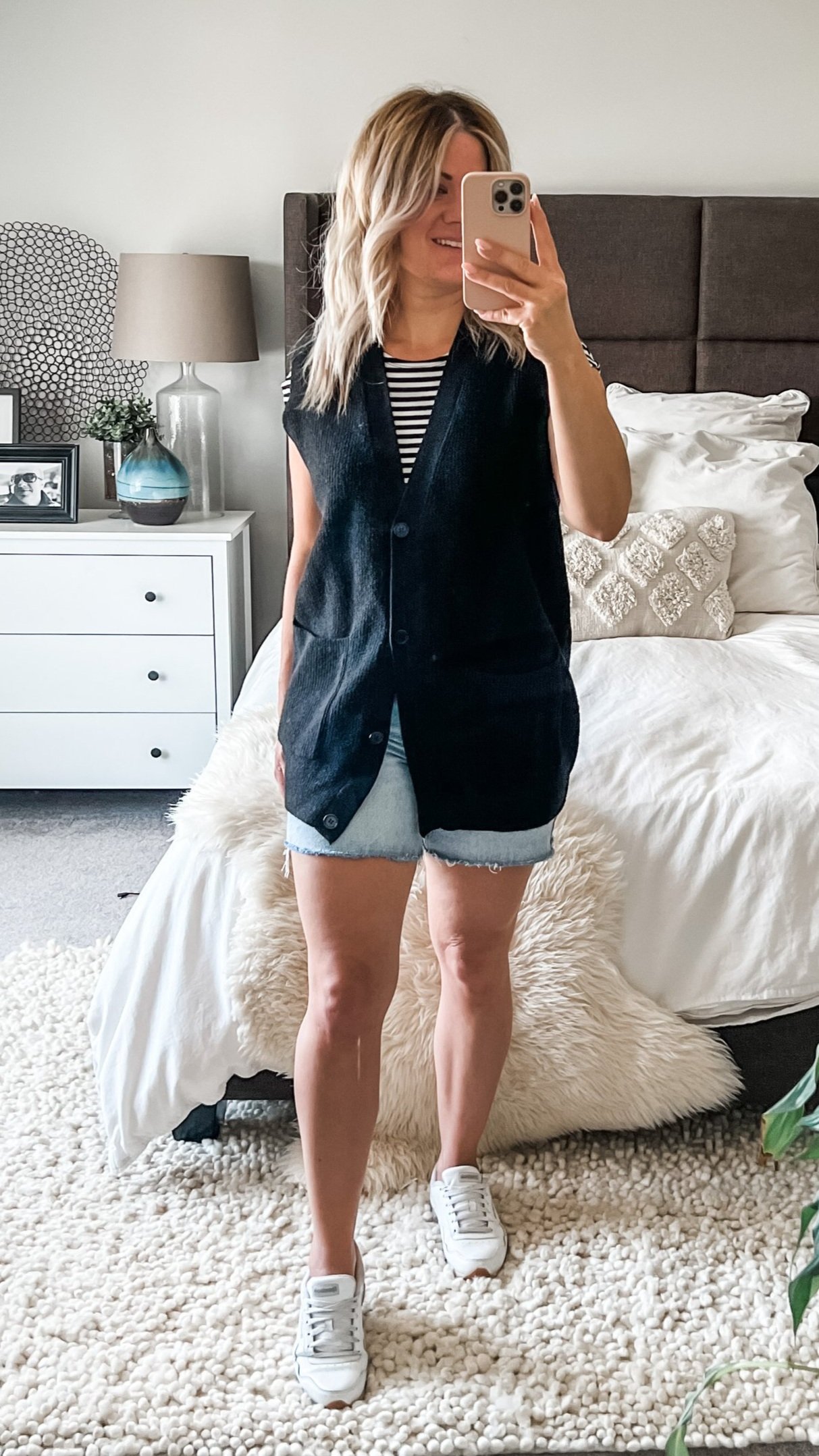 BUTTONED BLACK SWEATER VEST + JEAN SHORTS + STRIPED TEE + WHITE SNEAKERS 