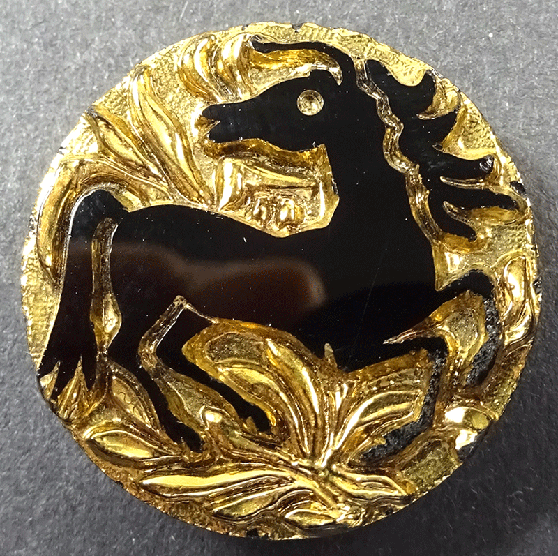 Black glass horse on gold