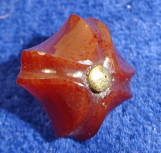 Small carved hardstone button