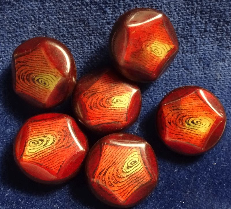 Set of 7 red stencilled celluloid