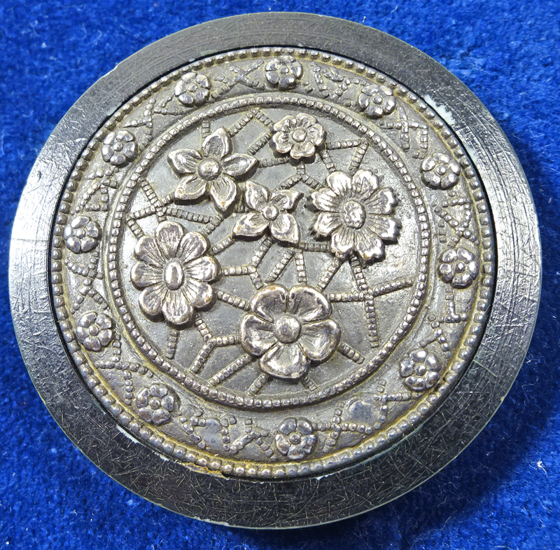 Large metal flowers on black base