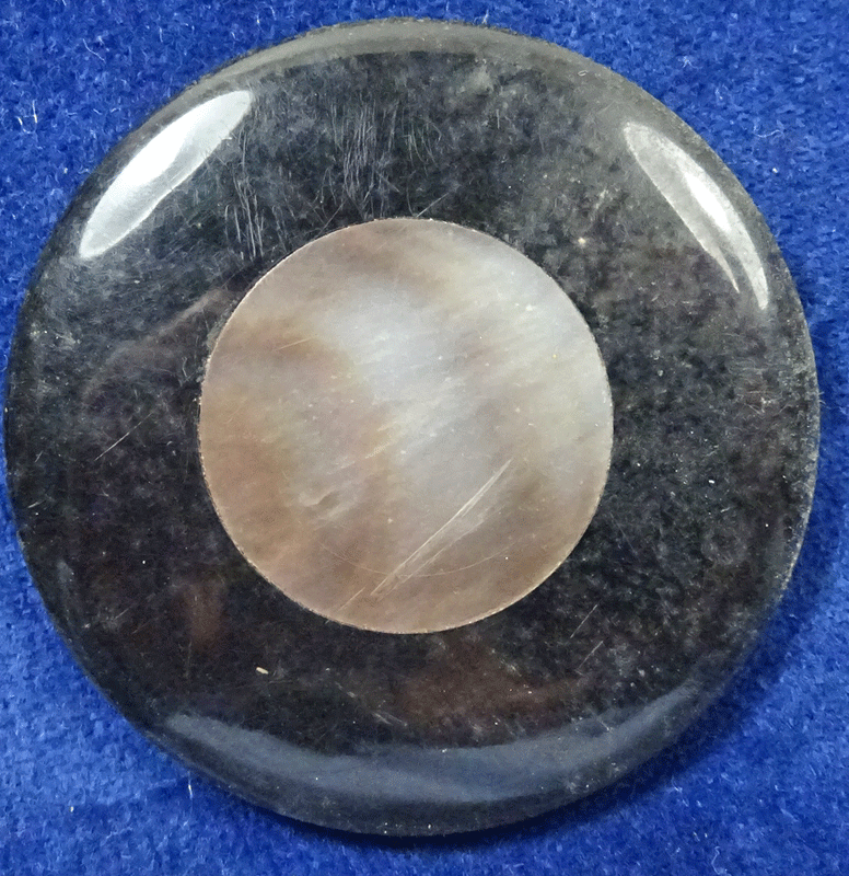 Large shiny black with pearl centre