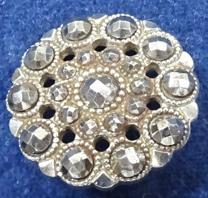 Antique riveted steel button